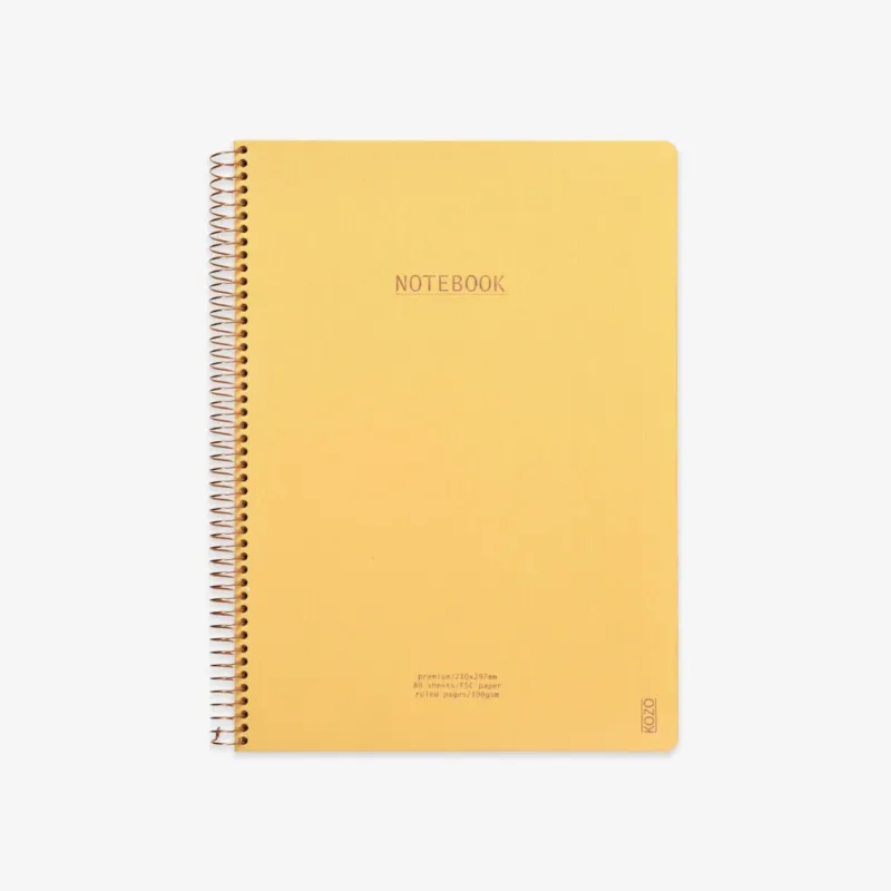 Yellow notebook with spiral binding on a white background