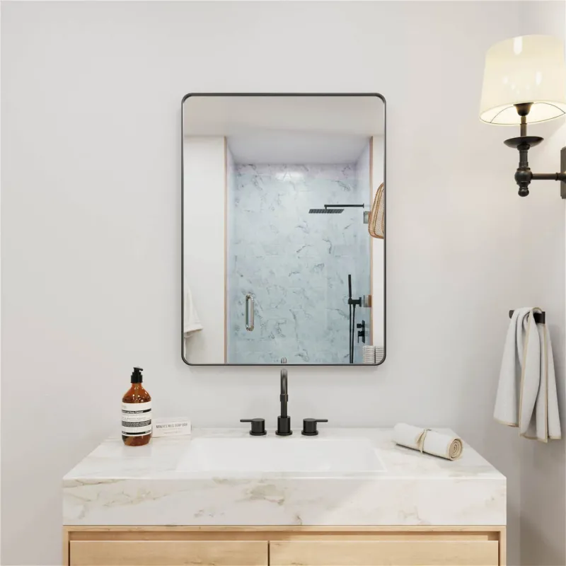 Black framed wall mounted rectangular bathroom mirror with rounded corners