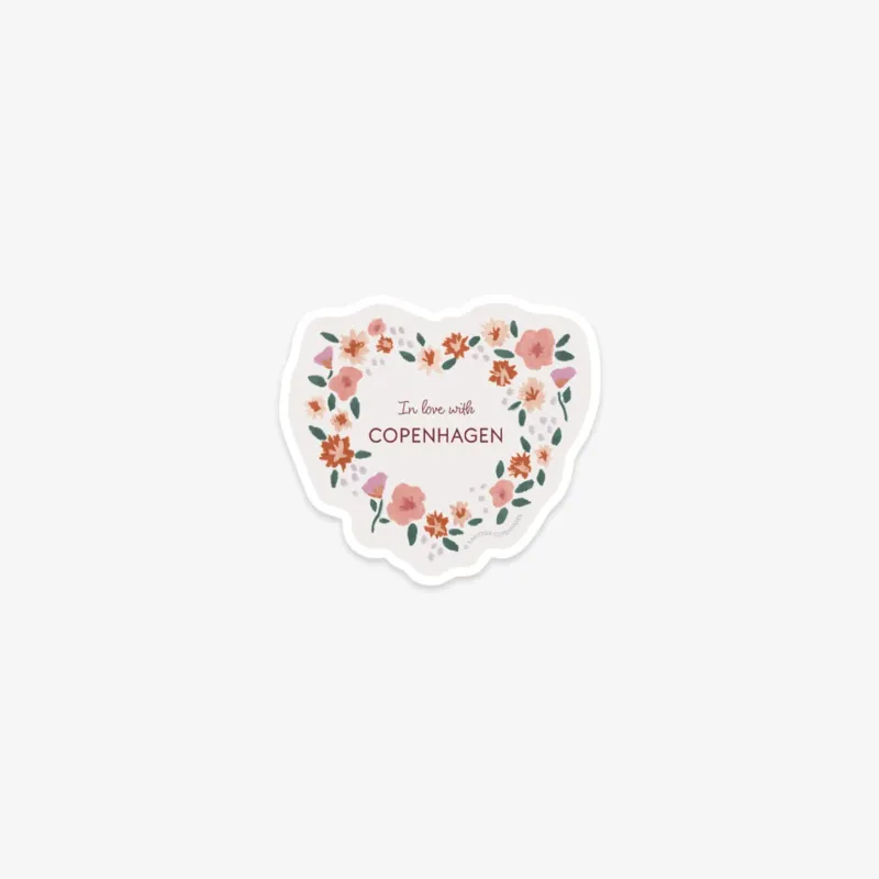 Heart-shaped sticker with floral design and 'I'm love with Copenhagen' text on a white background