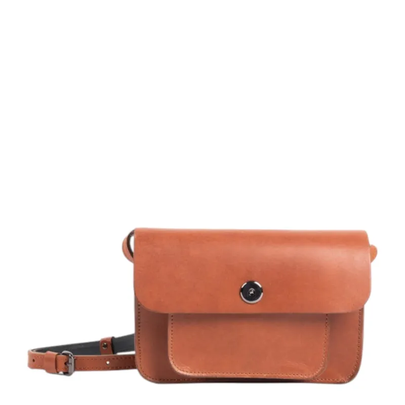 Lieblingstasche Abby crossbody bag in tan leather with a front pocket and silver button closure.